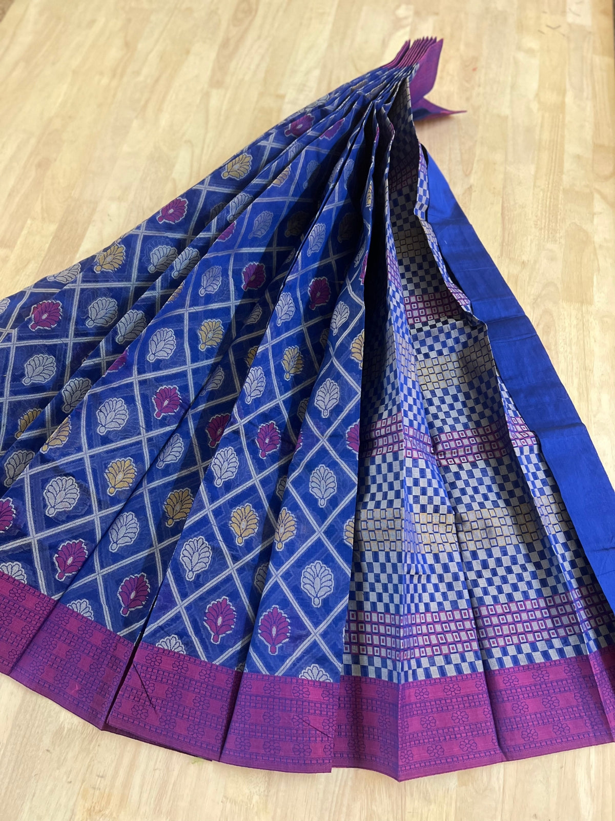 Blue semi-silk cotton saree with zari buttas, copper zari border & contrast  pallu beautified with traditional designs